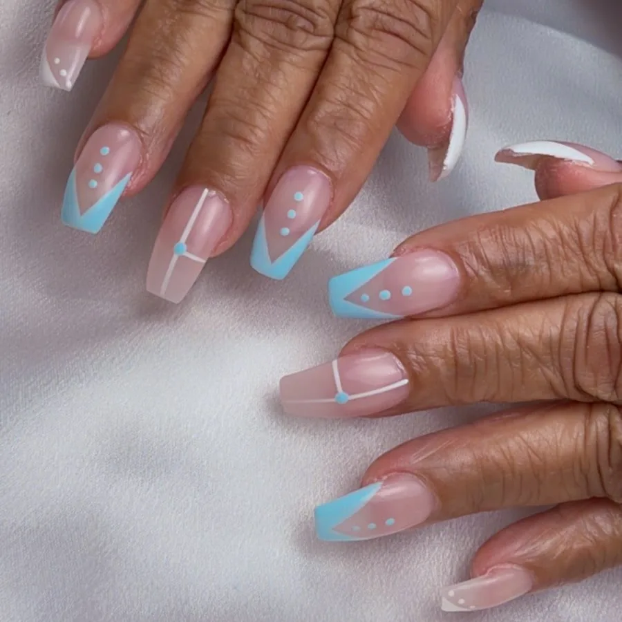 Long coffin acrylic nails with baby blue French tips at Yudy's Queen Nails in Palm Beach Gardens