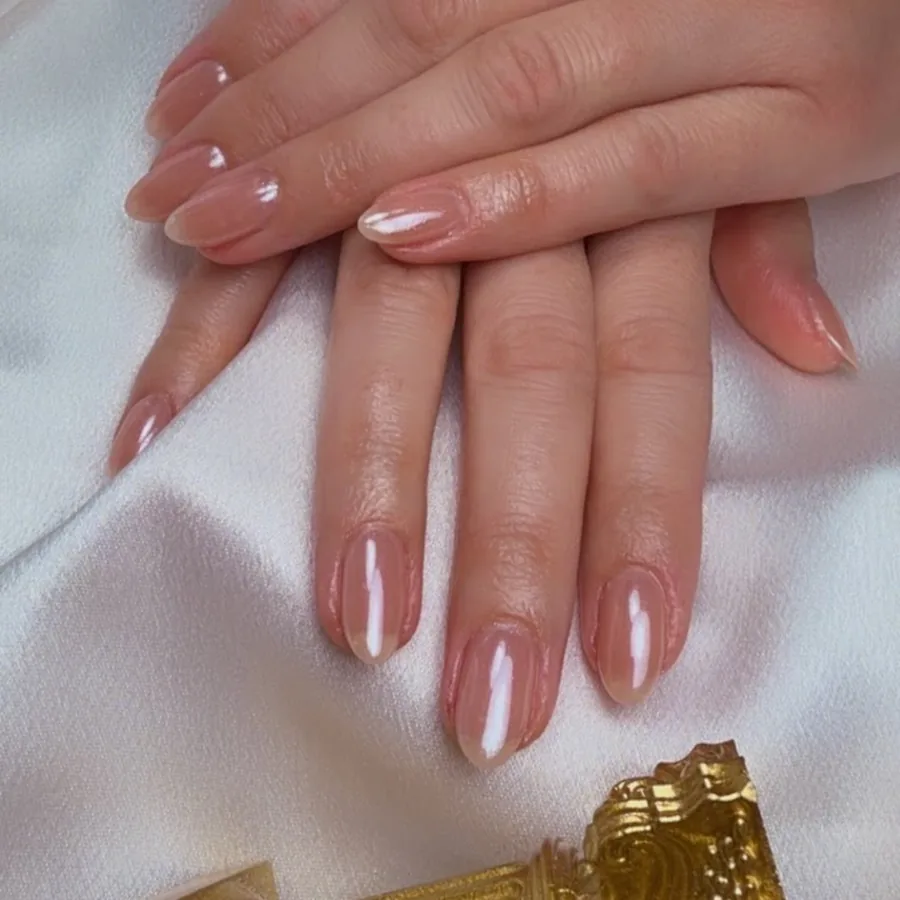 Almond gel manicure in a glossy soft pink at Yudy's Queen Nails in Palm Beach Gardens